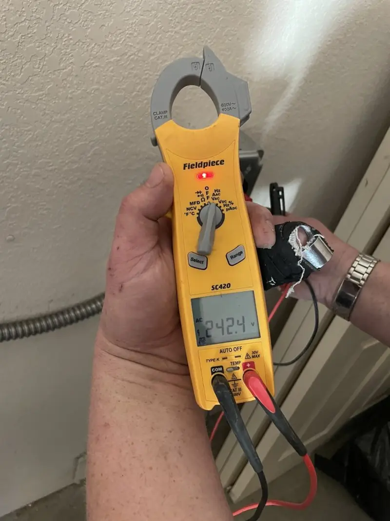 Voltage testing with clamp meter during Ceiling Fan Installation in Knox